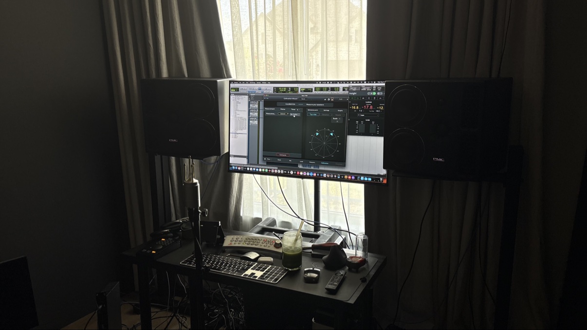 Matt Wolach's mix desk with a session on screen between studio monitors